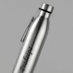 Personalized stainless steel water bottle with custom engraved name, leak-proof cap, and carry strap for office, gym, travel, and daily hydration.