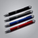 Laser engraved metal pens with personalised names, shown in a row - view 6