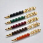 Premium gold flake pen with custom logo and name branding for corporate gifting