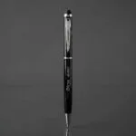 Custom engraved slim metal pen with stylus tip, presented as a premium gift - view 2