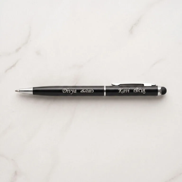 Custom engraved slim metal pen with stylus tip, presented as a premium gift