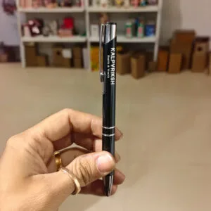 Laser engraved metal pens with personalised names, shown in a row