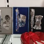 Corporate gift boxes with engraved pens and keychains ready for dispatch