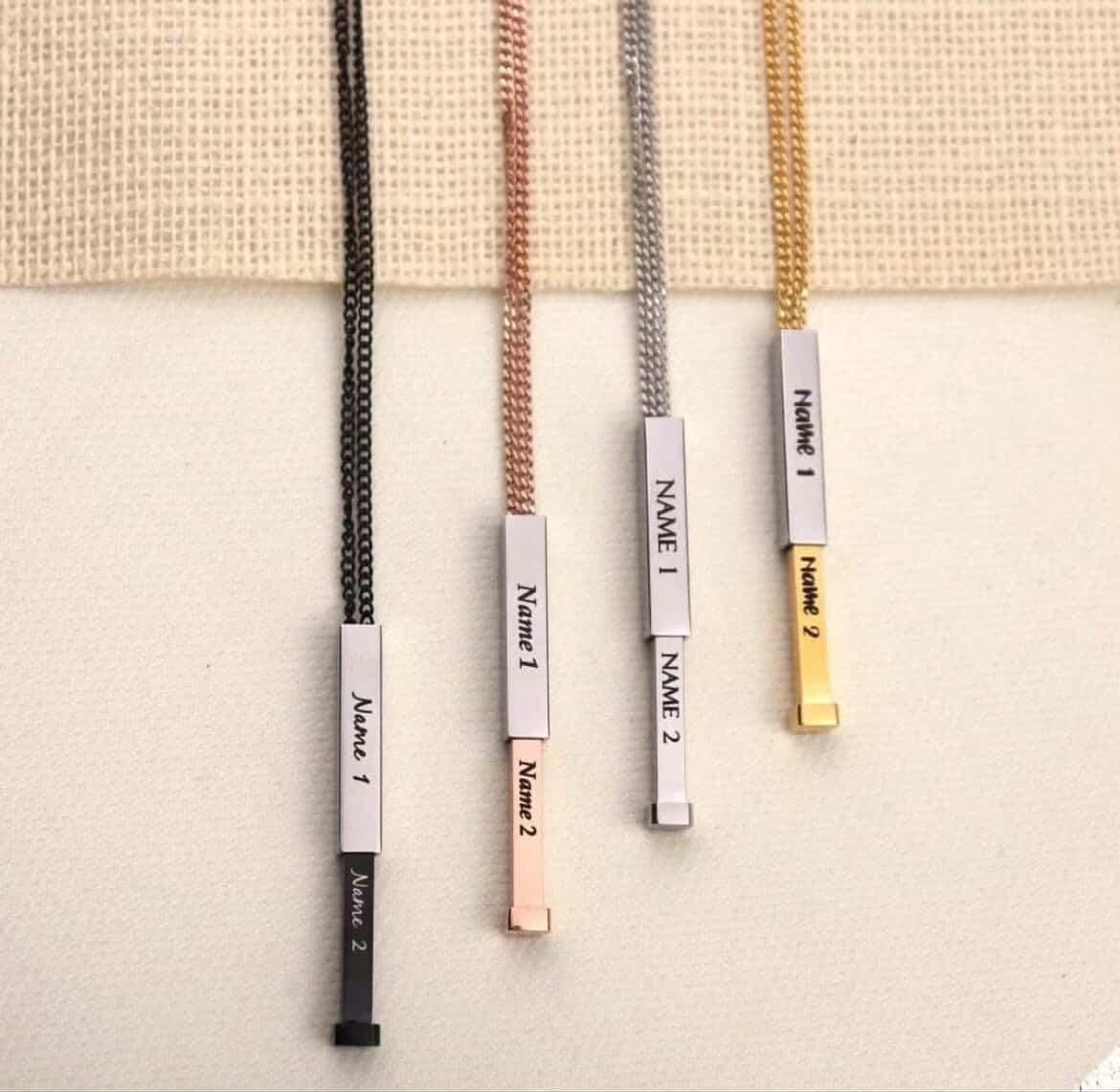 Engraved vertical bar name pendants with chains in black, rose gold, silver and gold