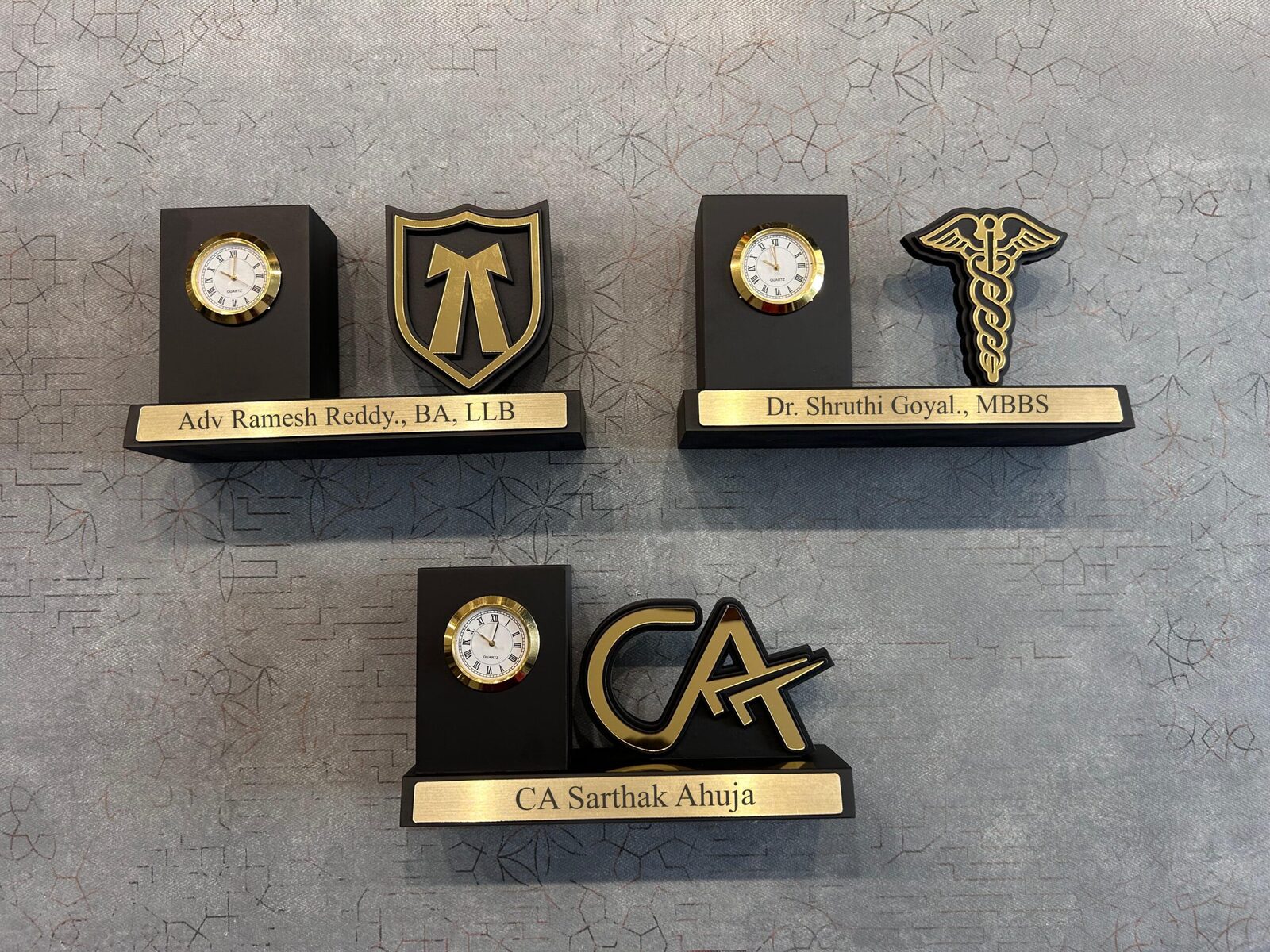 Wooden desk clocks with profession emblems and engraved name plates for doctors and advocates