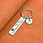 Personalised drive safe keyring engraved with a message and initial charm
