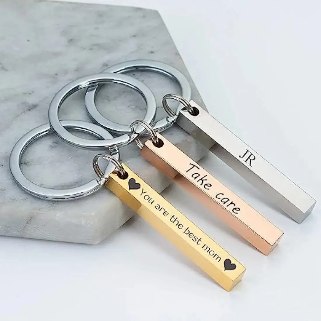 Personalised metal bar keyrings engraved with names and short messages