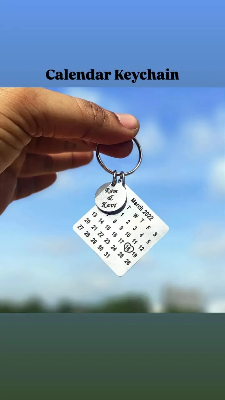 Custom calendar keychain engraved with a wedding date and names
