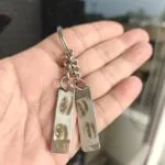 Pair of steel keyrings with photographs laser engraved on them