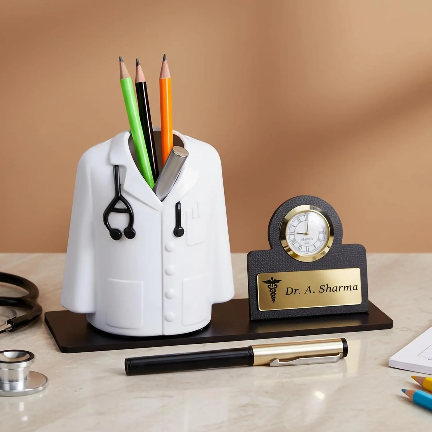 Doctor coat pen stand with a desk clock and engraved name plate