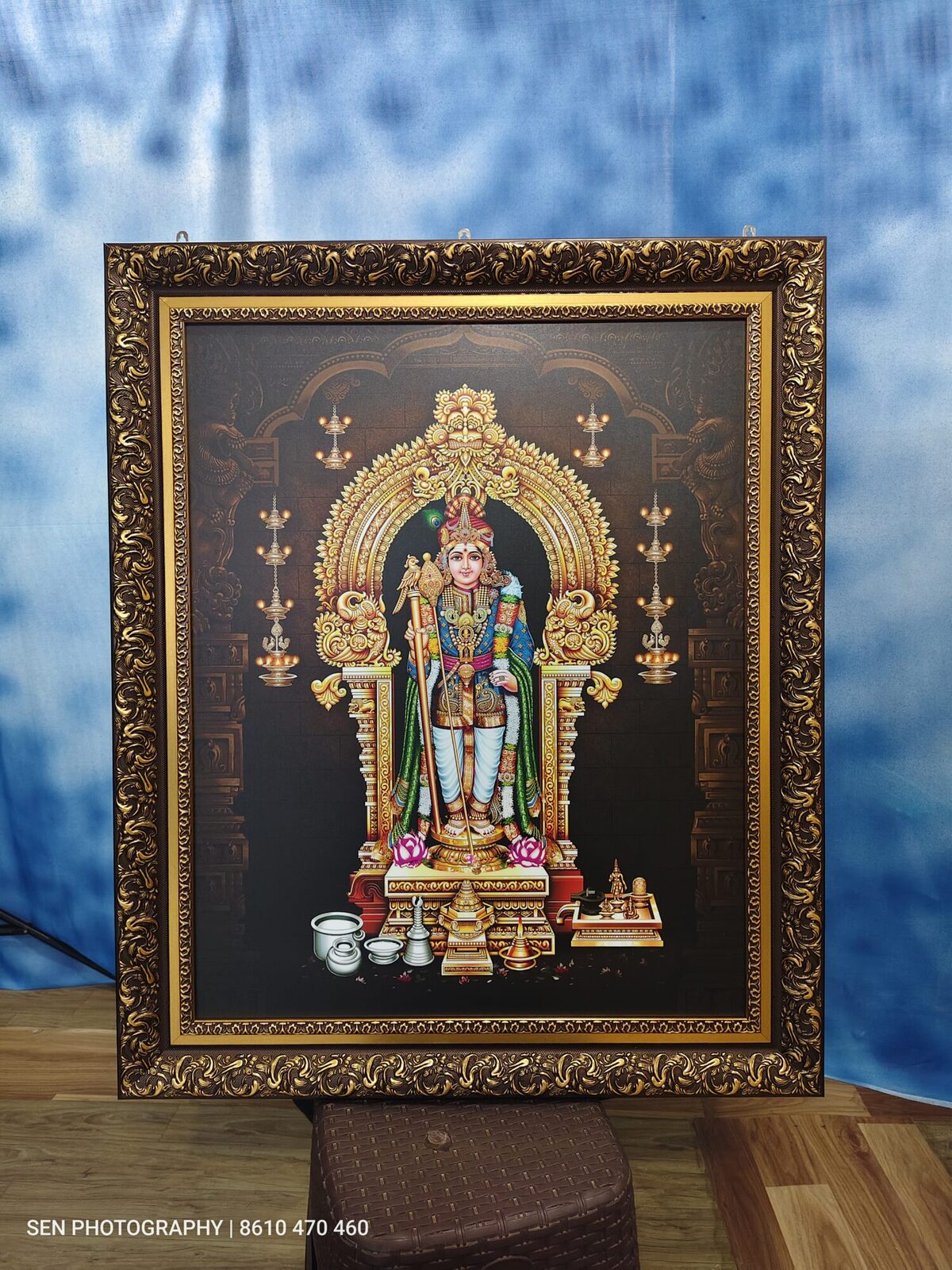 Framed Murugan photograph in an ornate gold finish frame