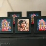 Set of framed photo prints including a child portrait and devotional frames