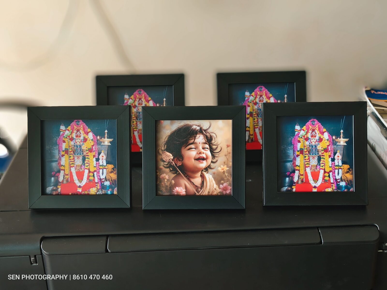 Set of framed photo prints including a child portrait and devotional frames