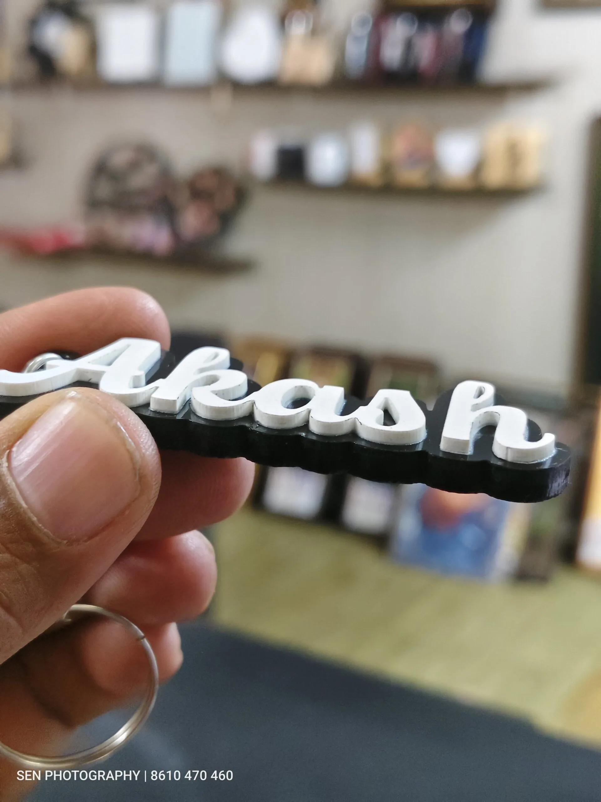 Side view showing the depth of a 3D acrylic name keyring