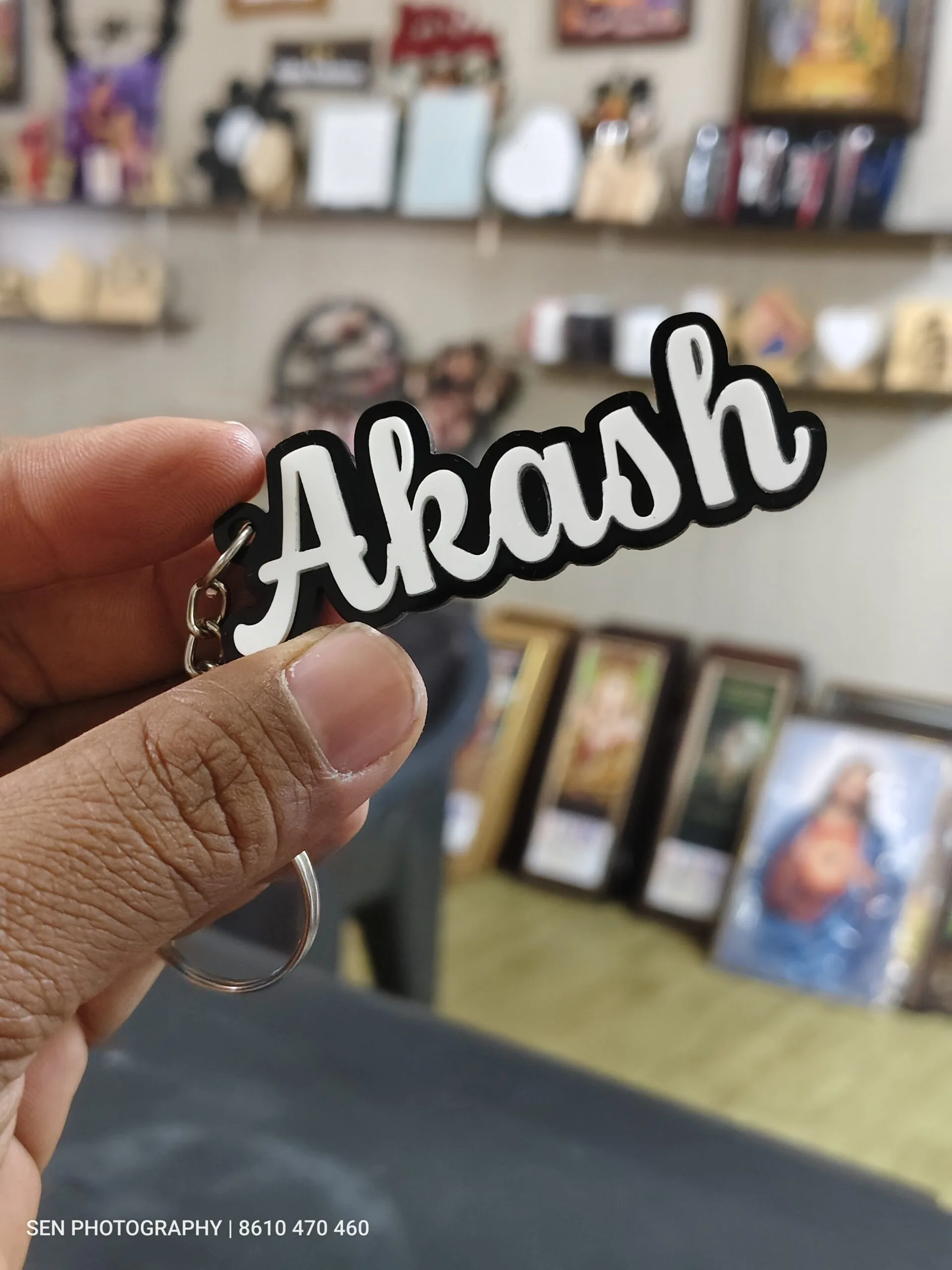 Custom cut acrylic letter keyring with a cursive name