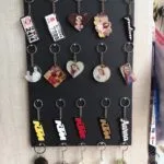 Rack of acrylic photo keychains in heart, round and square shapes