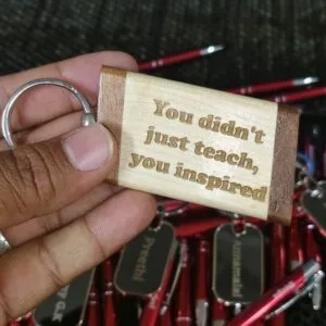 Wooden keychain engraved with the message You did not just teach you inspired