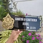Personalised acrylic name board with Ganesha symbol held in hand