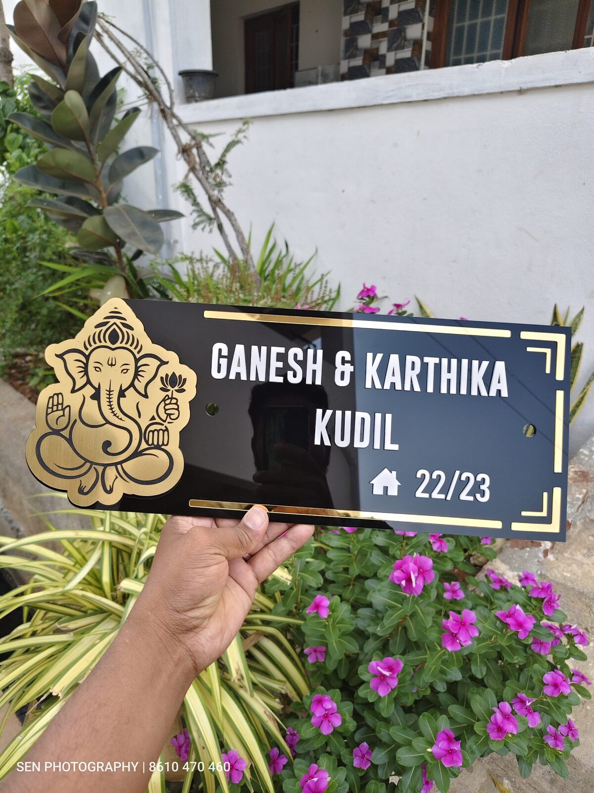 Personalised acrylic name board with Ganesha symbol held in hand