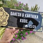 Gold mirror lettering on a black acrylic name board