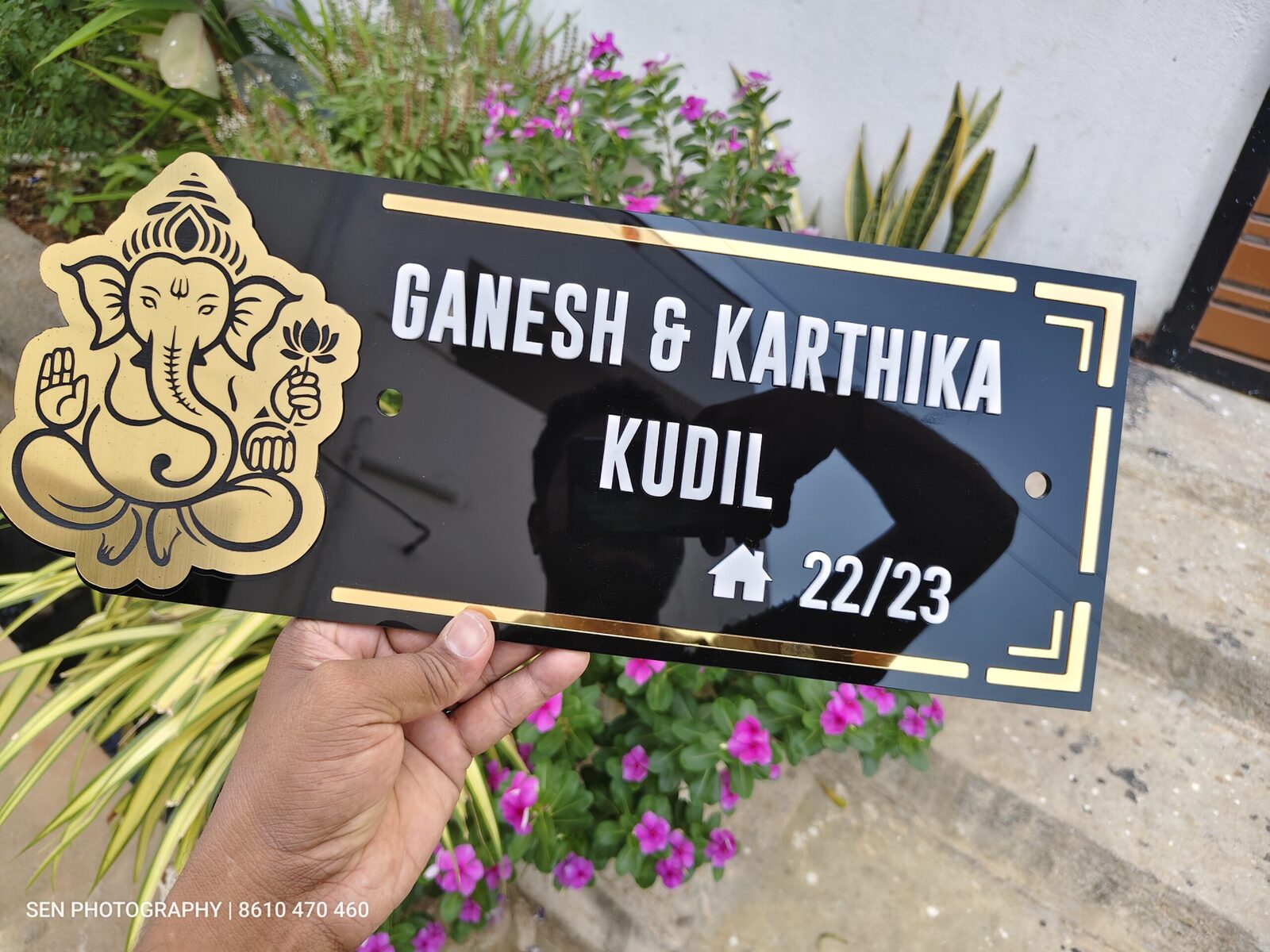 Gold mirror lettering on a black acrylic name board