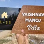 Personalised villa name board with house symbol and door number