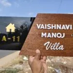 Close view of raised 3D letters on a wooden name plate