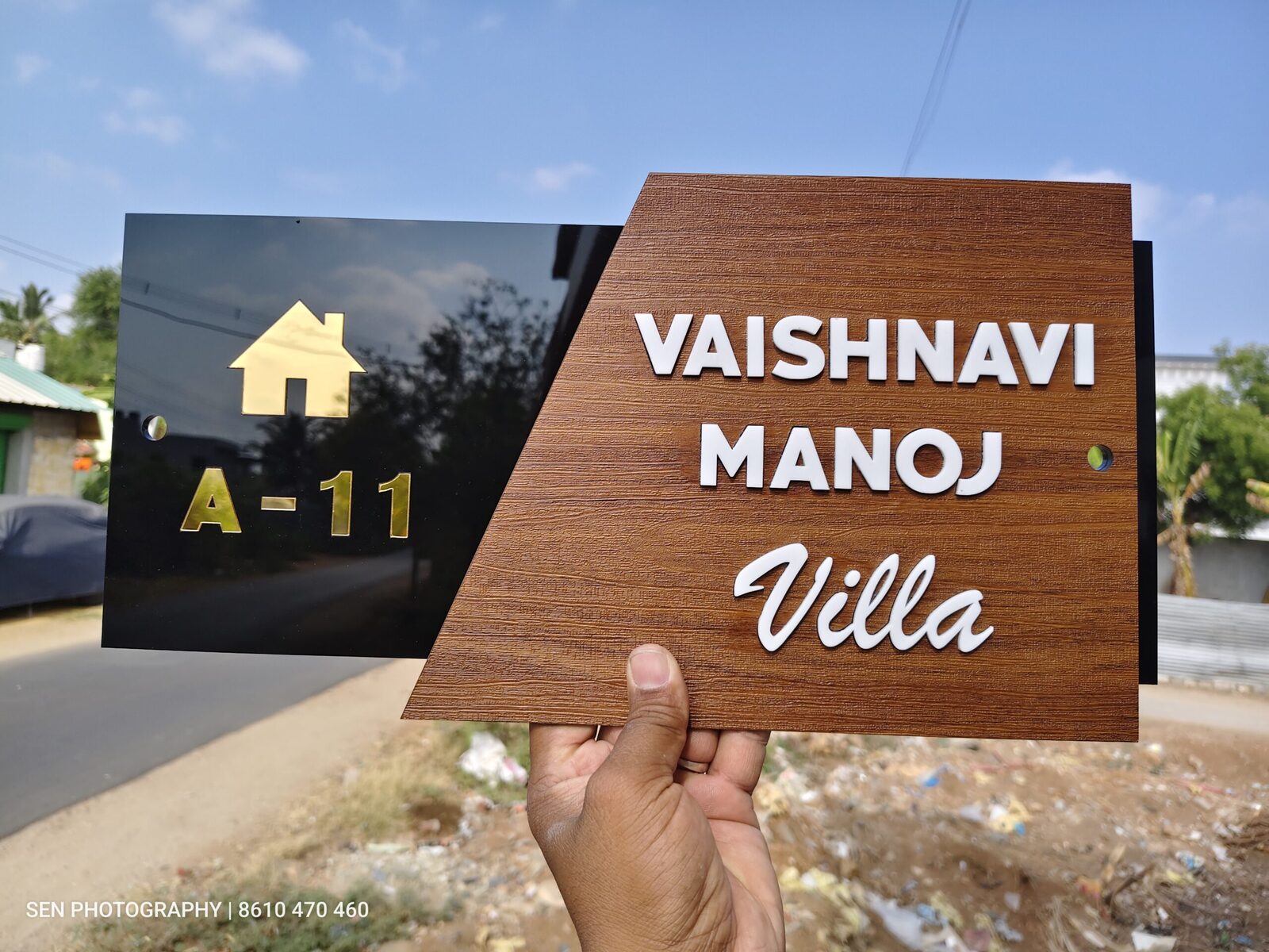 Close view of raised 3D letters on a wooden name plate