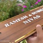 Wood name plate with decorative gold corner detailing