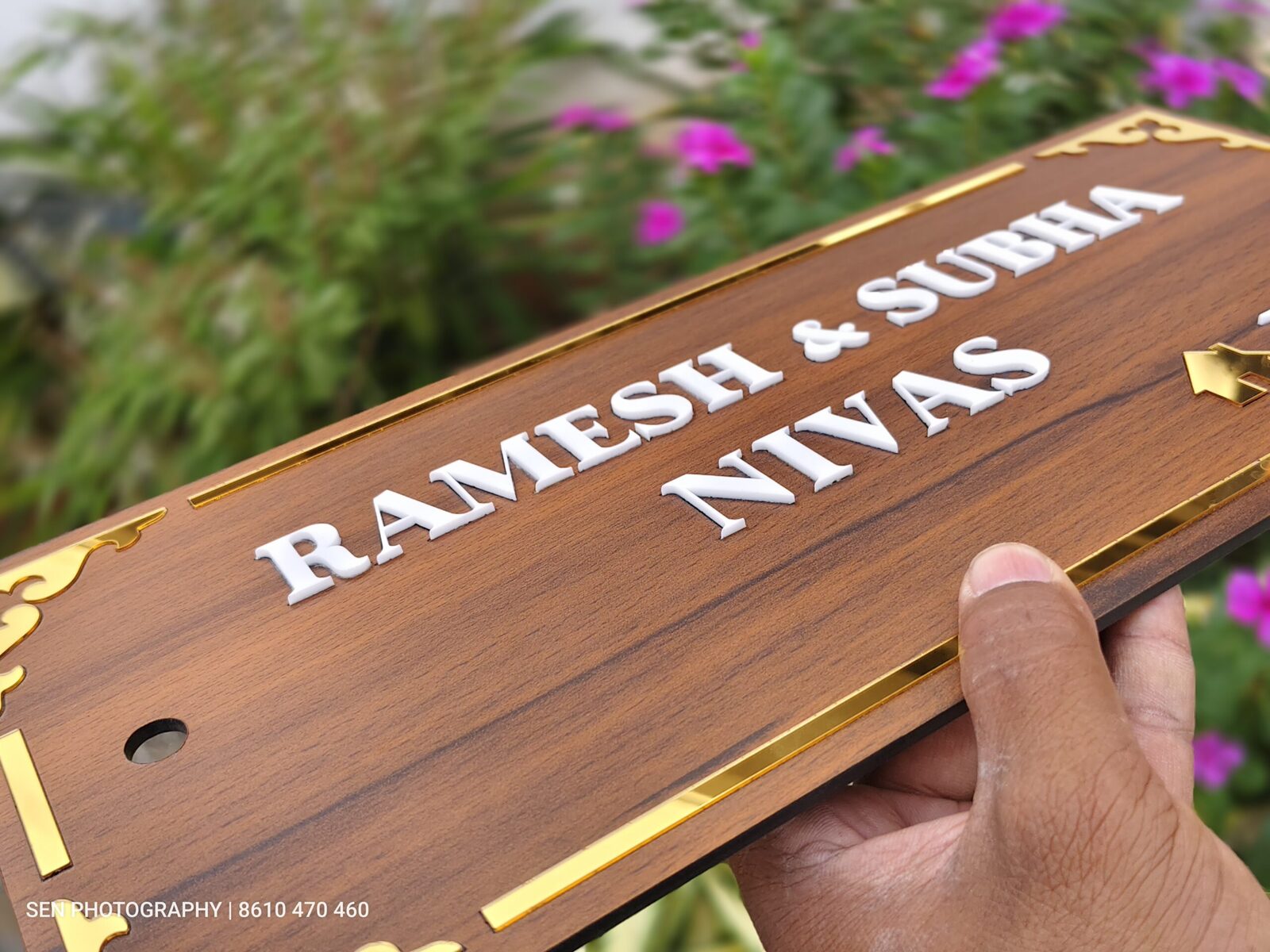 Wood name plate with decorative gold corner detailing