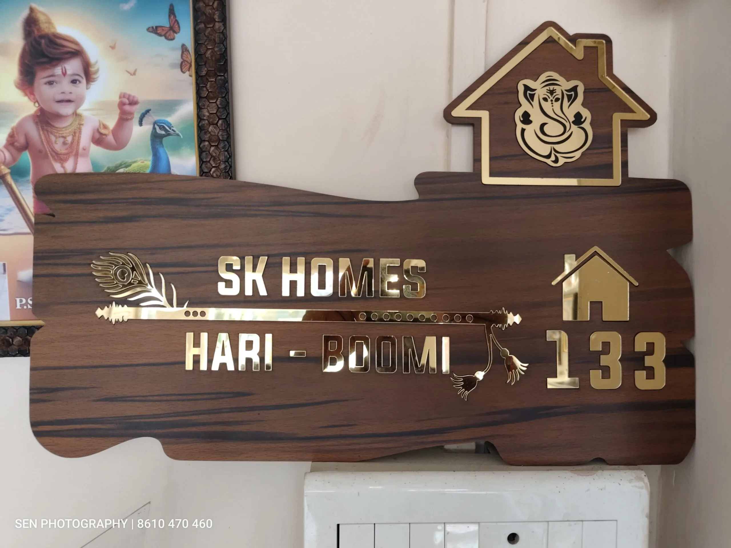 Wood finish name board with arrow and feather design for SK Homes