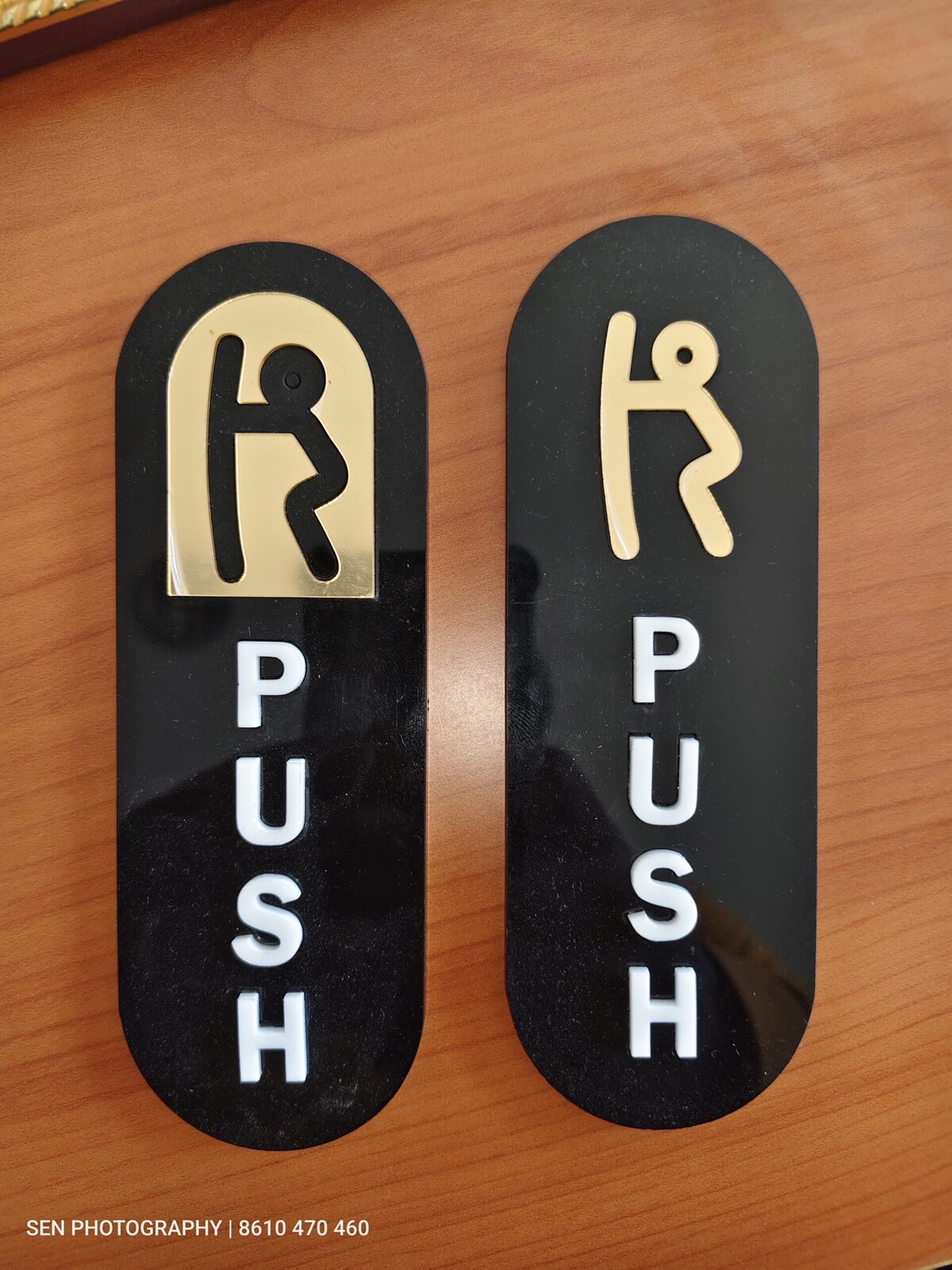 Acrylic letter signage in gold and white on a black board