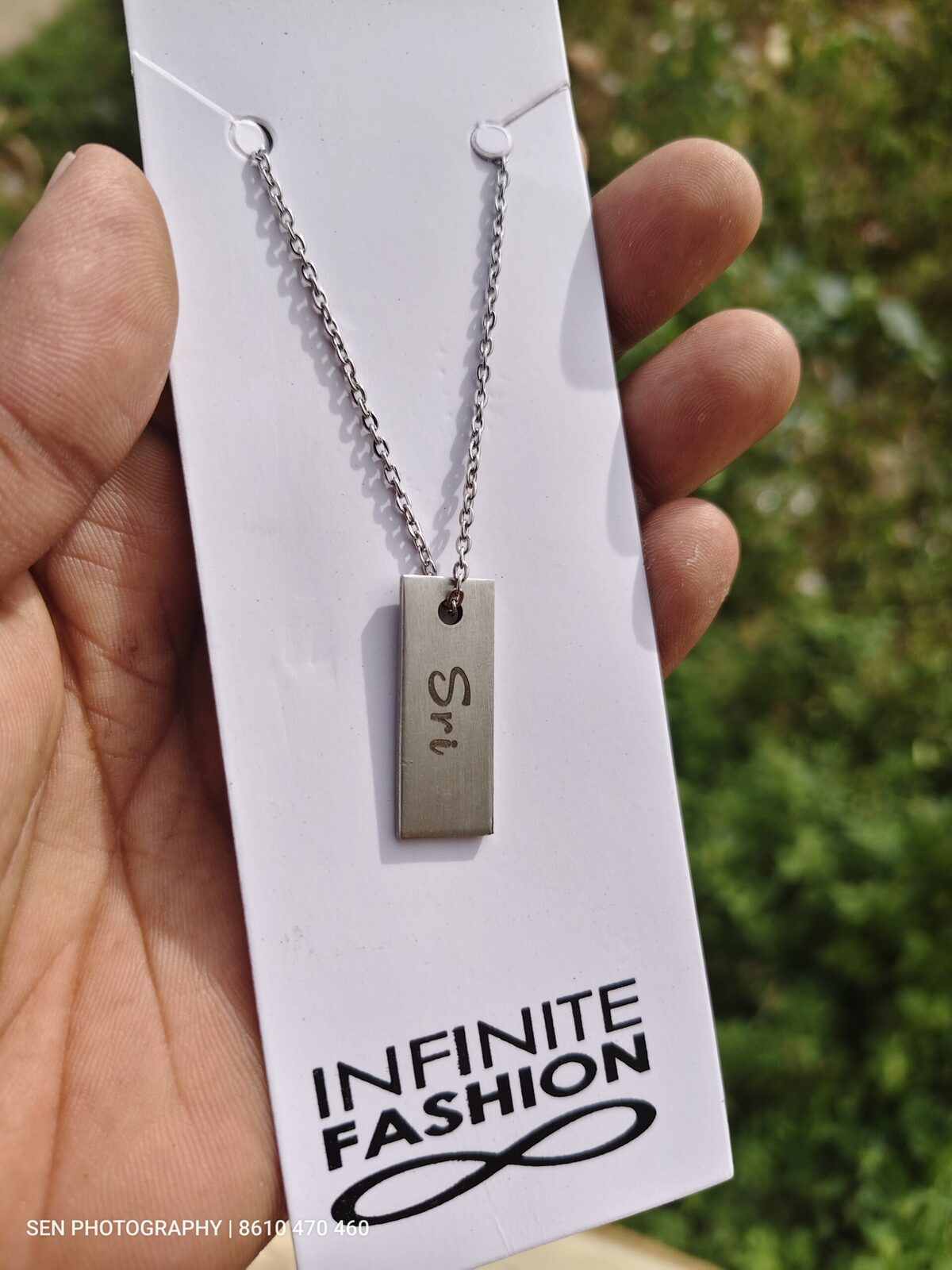 Slim engraved name pendant on a stainless steel chain