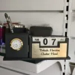 Wooden desk organiser with clock, perpetual calendar and engraved brass name plate
