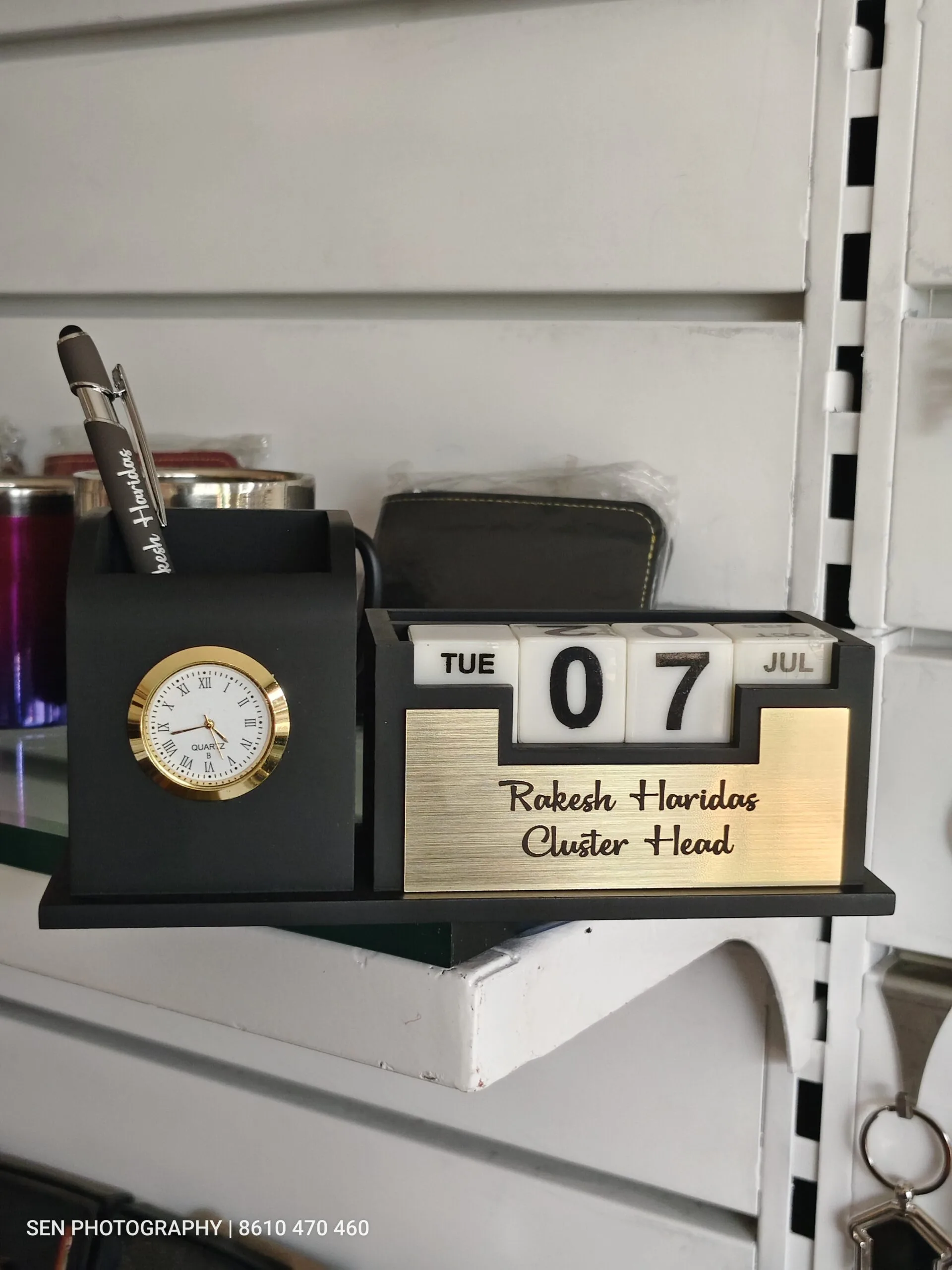 Wooden desk organiser with clock, perpetual calendar and engraved brass name plate
