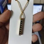 Personalised bar pendant engraved with a name on a ball chain