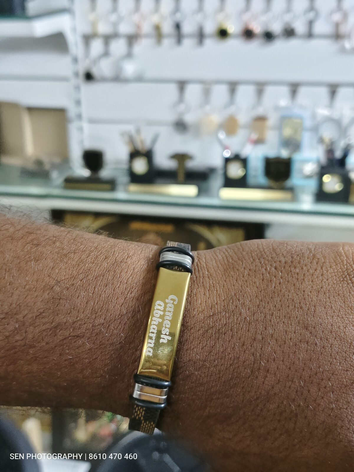 Gold steel name bracelet engraved with a name worn on the wrist