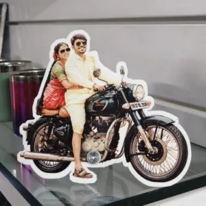 Acrylic photo cutout standee of a couple on a motorcycle