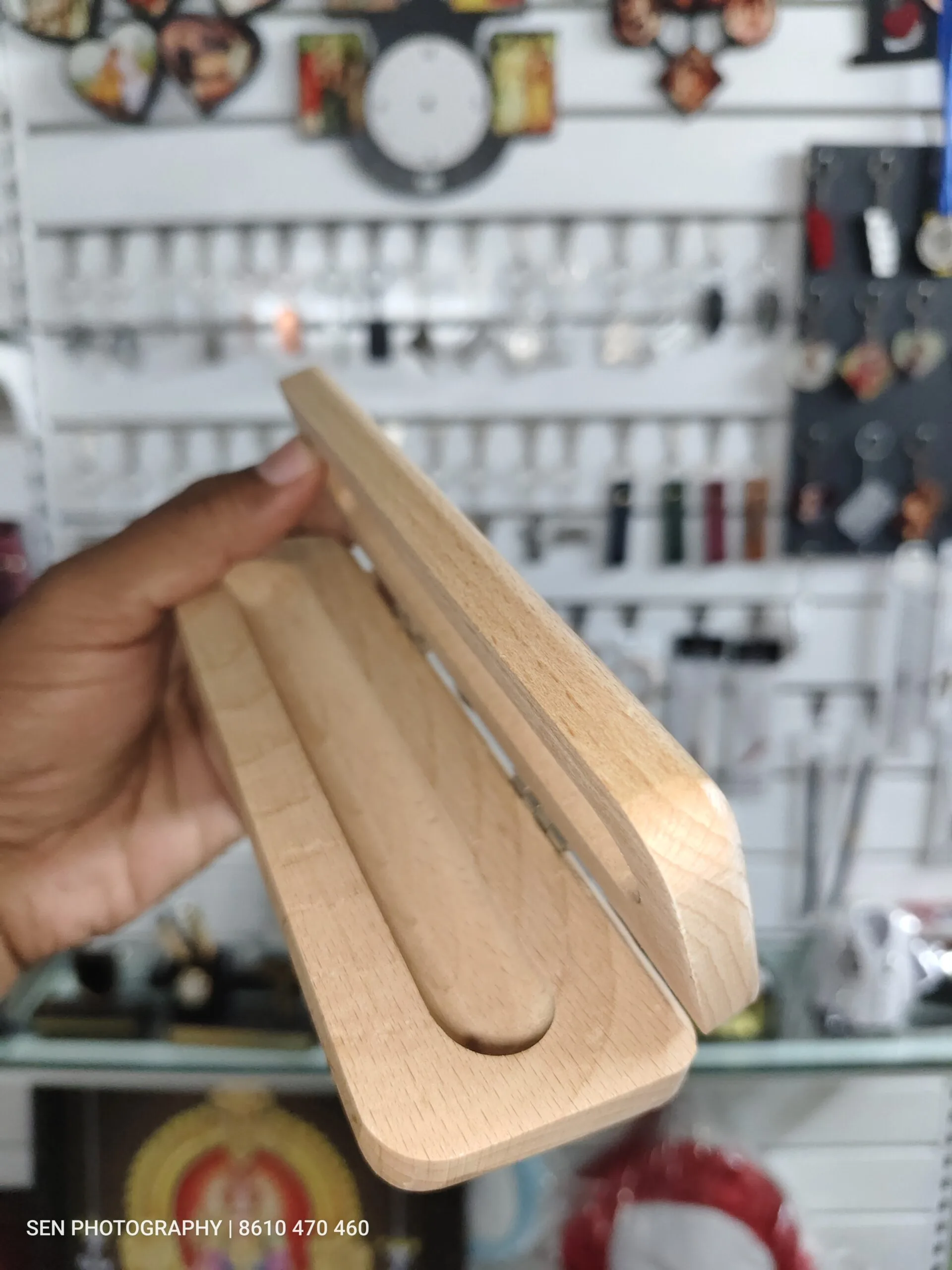 Wooden pen box with the sliding lid partly open