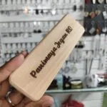 Wooden pen box engraved with a personalised name on the lid