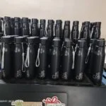 Batch of personalised black steel bottles engraved with names