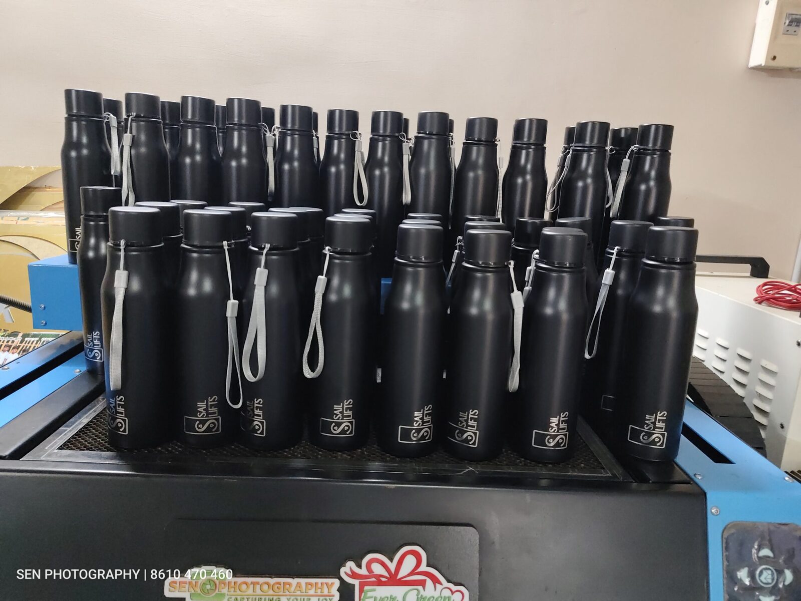Batch of personalised black steel bottles engraved with names