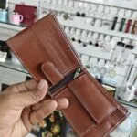 Inside view of a personalised leather bifold wallet with card slots and coin pocket