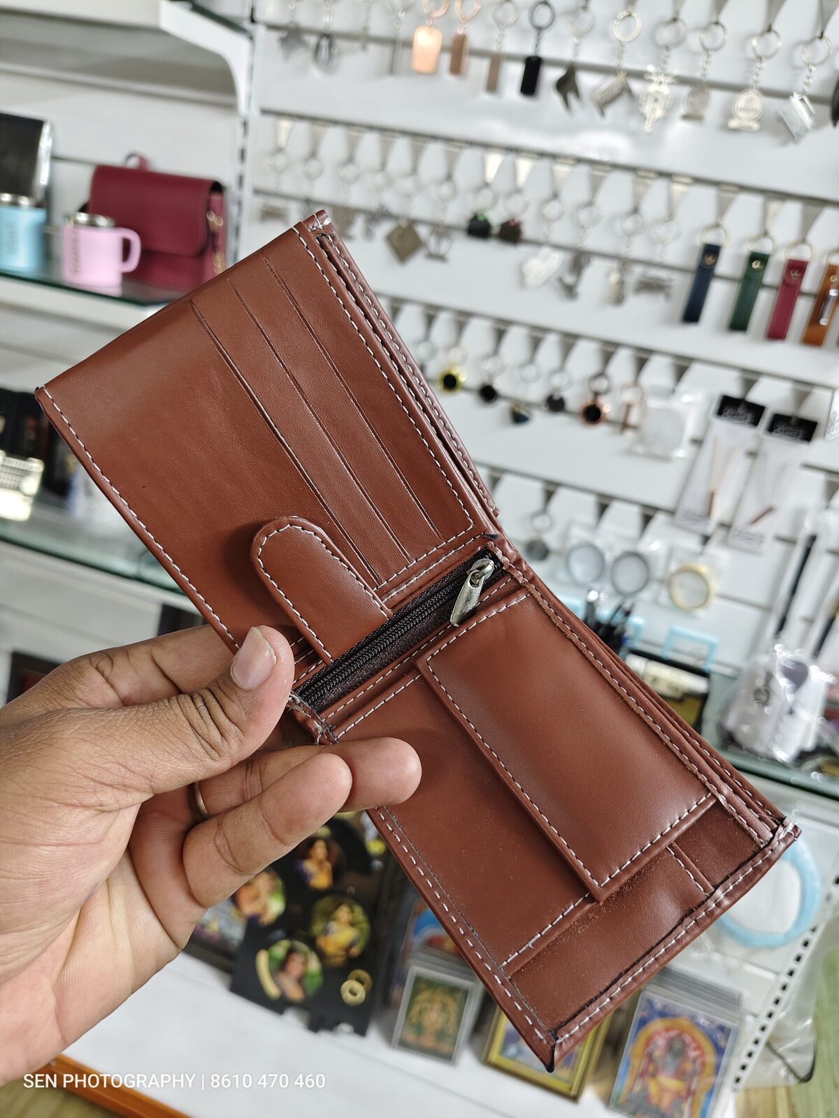 Inside view of a personalised leather bifold wallet with card slots and coin pocket