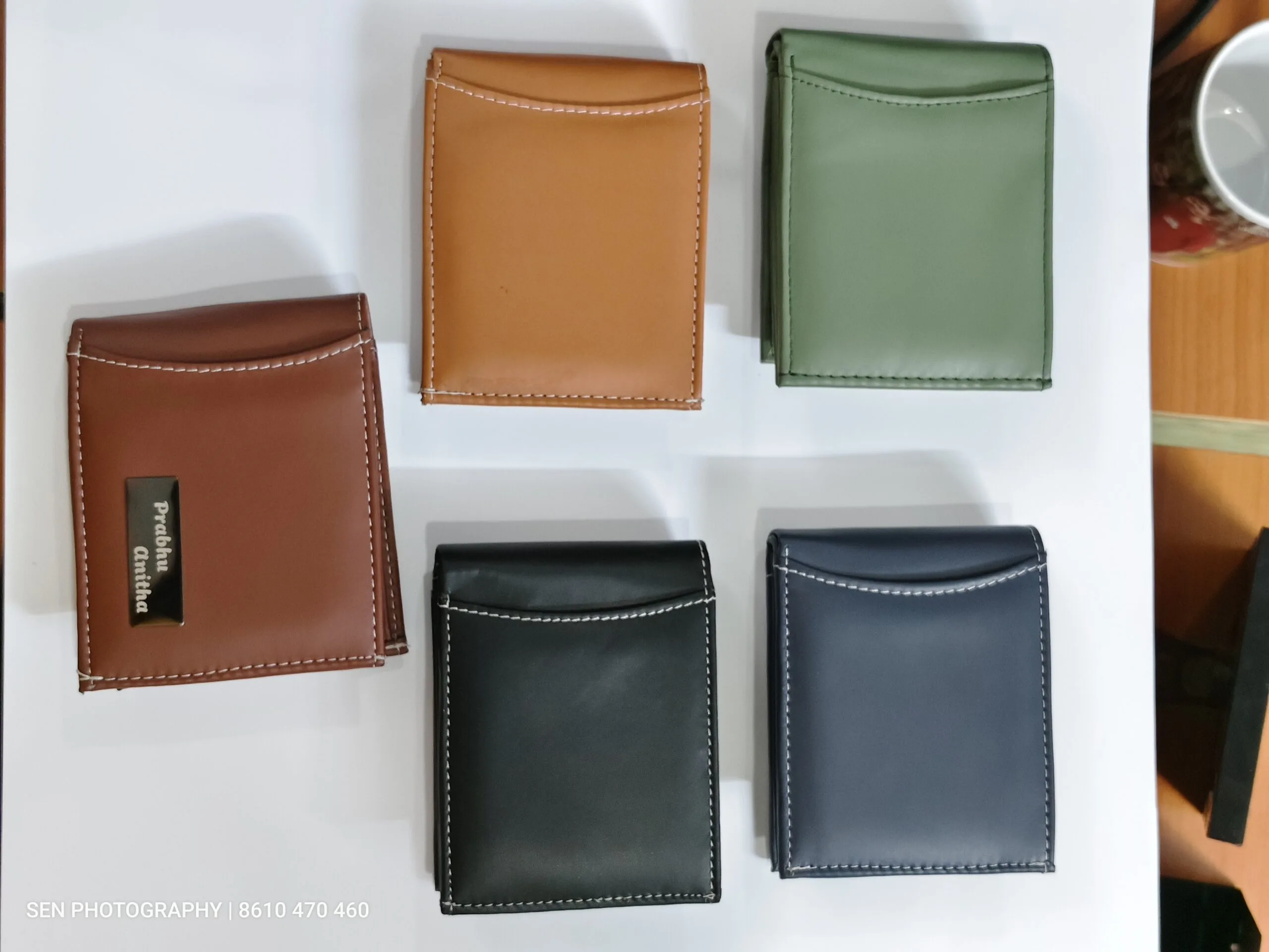 Slim leather card holder wallets in tan, brown, black, blue and green