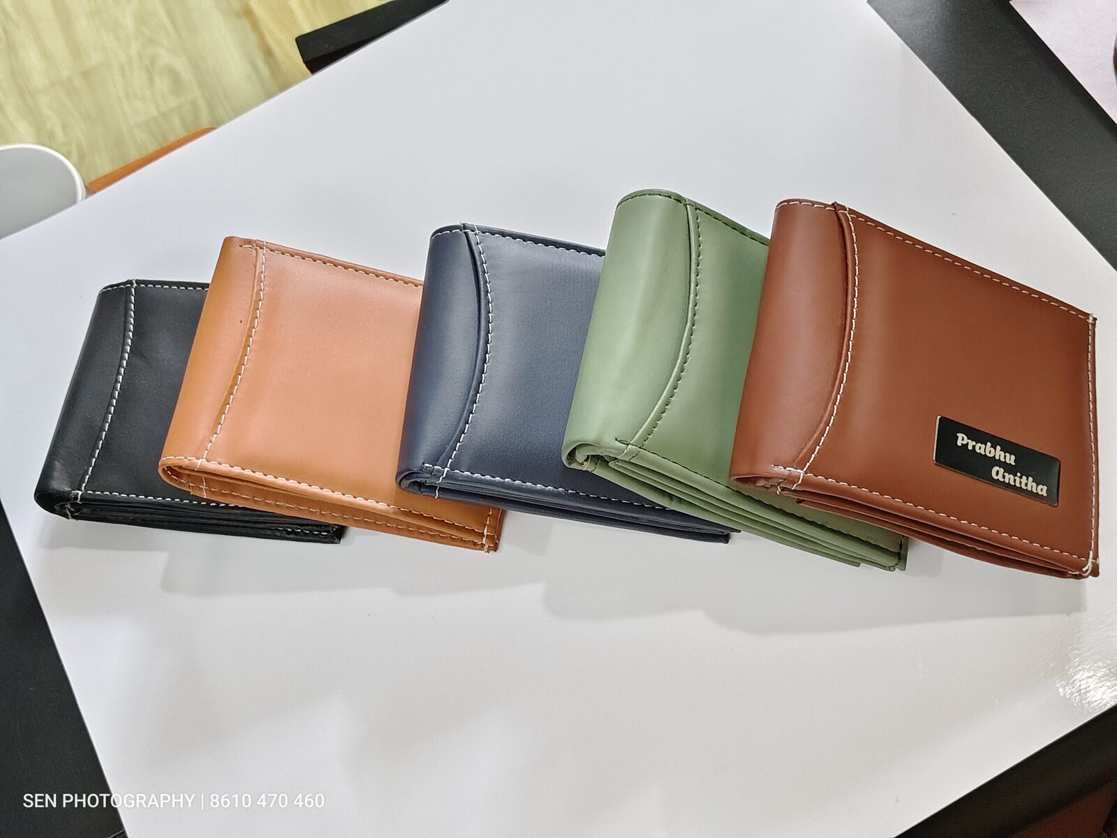 Row of compact RFID leather wallets in five colours