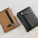 Tan and black slim wallets with metal card holders and strap closure