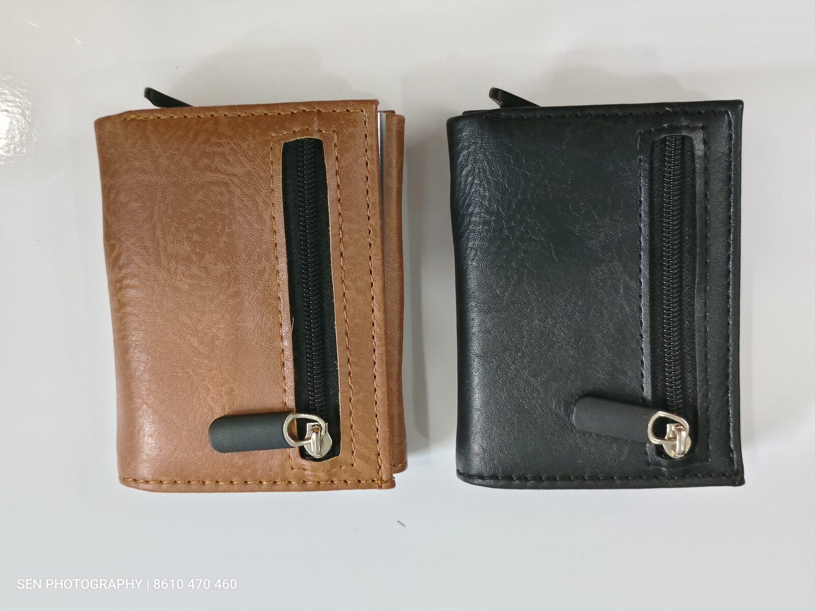Front view of brown and black pop up card holder wallets