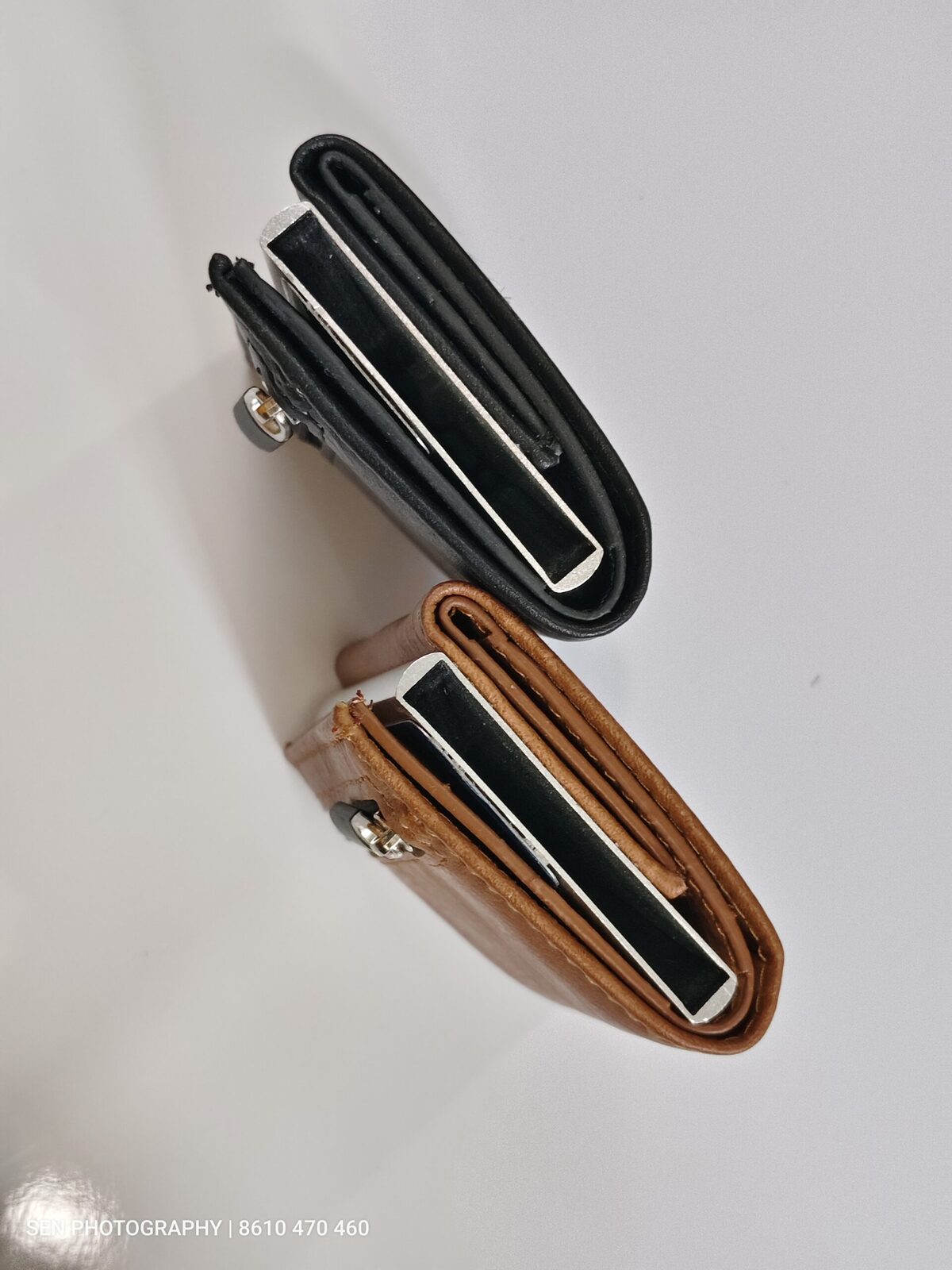Side profile of two slim metal card holder wallets
