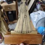 Wooden engraved photo cutout standee of a girl on a wooden base